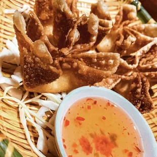 Crab Rangoon   Fried wonton wrapped and filled with blend of cream-cheese, imitation crab meat and garlic flavored seasoning served w