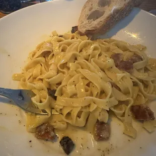 Carbonara. Small Amount of guanciale and not a creamy sauce. More like a butter sauce. Not the best carbonara.