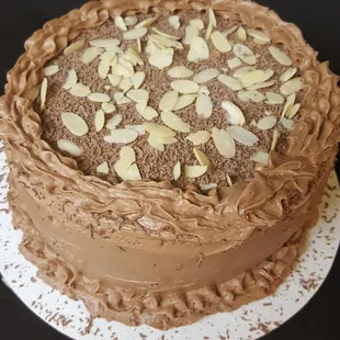 a chocolate cake with almonds on top