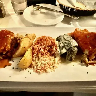 Greek sampler (dolmades, pastitsio, moussaka) with rice and potatoes