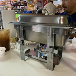 Barbacoa De Borrego comes in this to keep warm