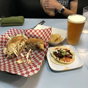 Pulled pork sandwich, barbacoa taco and IPA