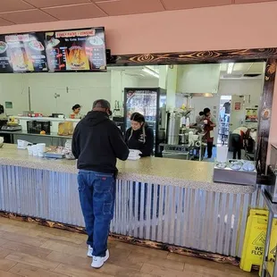 a man standing at a counter