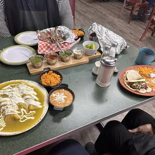 Enchiladas verdes, barbacoa, rice, beans, salsas and some extras to dress the food.