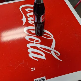 a coke bottle on a table
