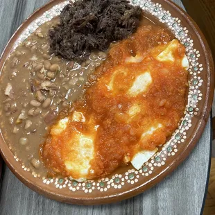 Huevos rancheros , beans and Barbacoa plate