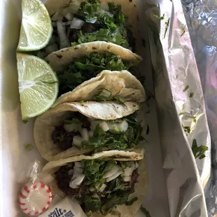 4 Barbacoa tacos, salsas not shown.