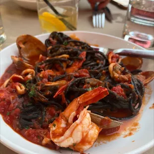 a plate of seafood and pasta