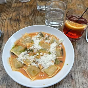 Spinach ricotta ravioli with tomato oil. Negroni Sbagliato