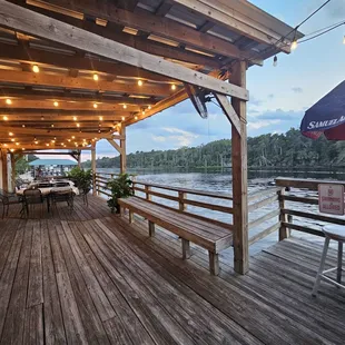 a deck with tables and chairs
