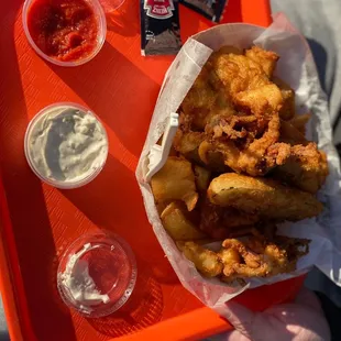 Mini fish trap includes tartar sauce and cocktail sauce . Vinegar available from counter.