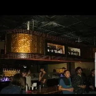 a group of people at a bar