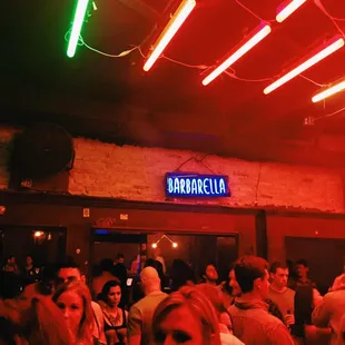 a crowd of people in a bar