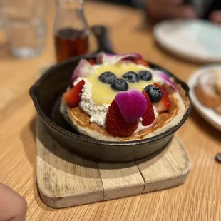 a pancake with fruit on top