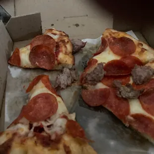 four slices of pepperoni pizza