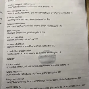 a list of drinks on a table
