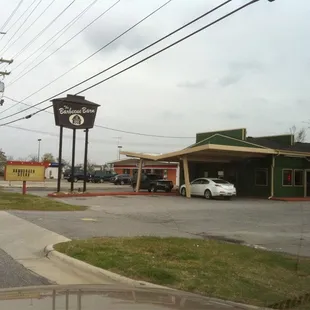 a car parked in front of a restaurant