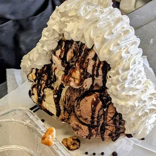 Staff making the biggest ice cream dish I've ever seen