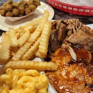 Coarse chopped pork, w chicken breast, fries, Mac n cheese, fried okra, hush puppies.