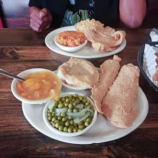 Fried Whiting dinner with Mash Potatoes and gravy, Green Peas,  Peach Cobbler. Delicious!