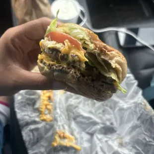 Double Cheeseburger with lettuce, tomato, onion, mustard, chili, and slaw