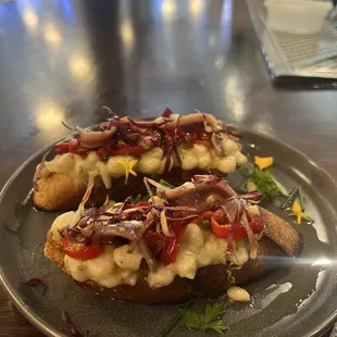 Bruschetta with crushed cannellini beans, anchovy, peppers, capers