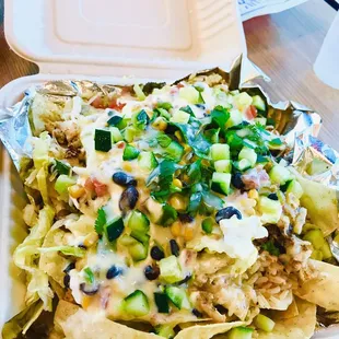 Chicken Nachos - they have regular chicken and spicy chicken
