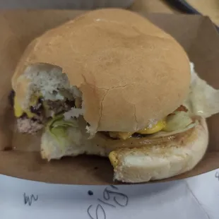 Cheeseburger with lettuce mayonnaise and grilled onions