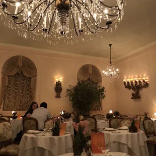 a dining room with a chandelier