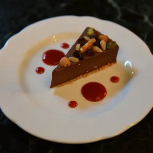 a piece of chocolate cake on a white plate