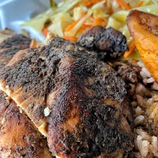 Jerk chicken, brown rice w/oxtail gravy, cabbage, sweet plantain