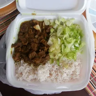 Curry goat with white rice.