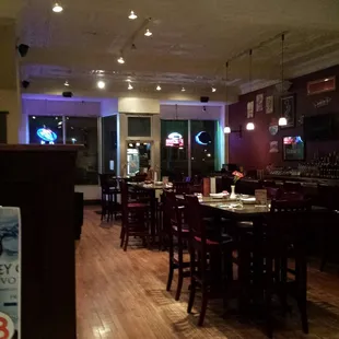 The room with the bar is darker