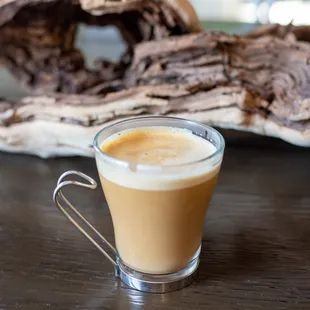 a cup of coffee on a table