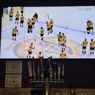 a hockey game on a big screen