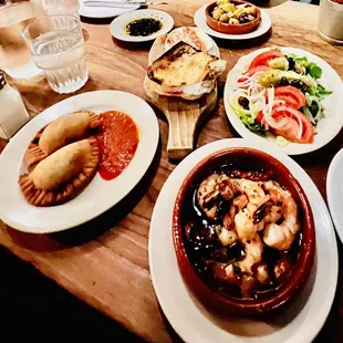 Gamba, Empanadas, goat cheese, marinated olives and salata mixta.