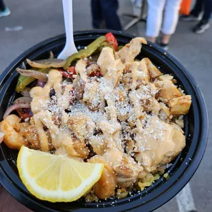 a person holding a bowl of food