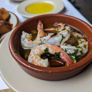 a bowl of shrimp and potatoes