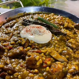 a bowl of food with a spoon in it