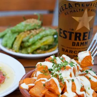 a plate of food and a glass of beer