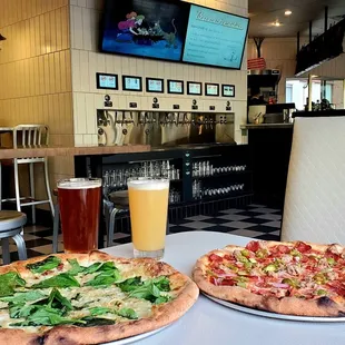 On the left - my delicious Walla Walla veggie pizza with extra basil and to the right - Supreme pizza with pepperoni and sausage!