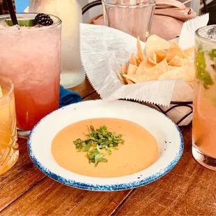 a bowl of soup and drinks
