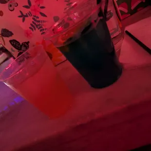 Cadillac drink to the left. Blue magic on the right. Both $18. Cadillac was served in a Much smaller plastic cup