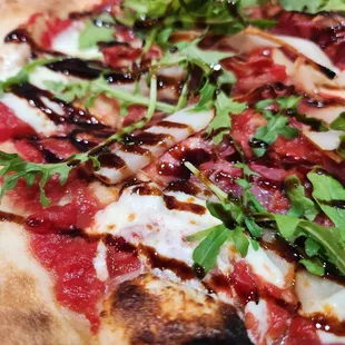 Goomba close-up. "Fresh mozzarella, prosciutto, pears, arugula, and balsamic glaze."  DELISH.