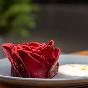 a red rose on a plate