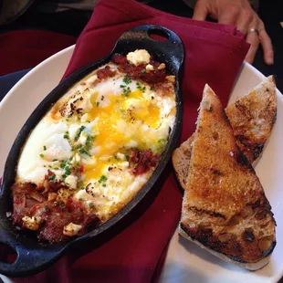 Eggs cocotte...looked prettier, but the husband could not wait to dig in!  Pulled lamb under the eggs...