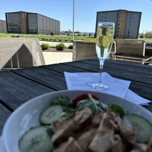 enjoying chicken salad and prosecco on the patio