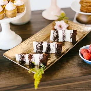 a plate of desserts on a table