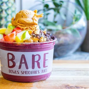 a bowl of fruit and ice cream