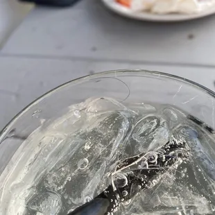 a knife in a bowl of ice